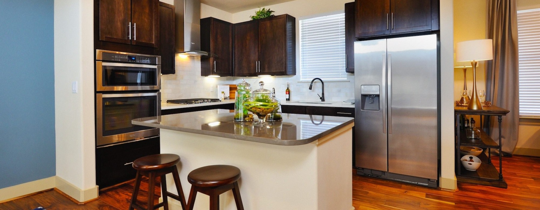 a kitchen with black cabinets