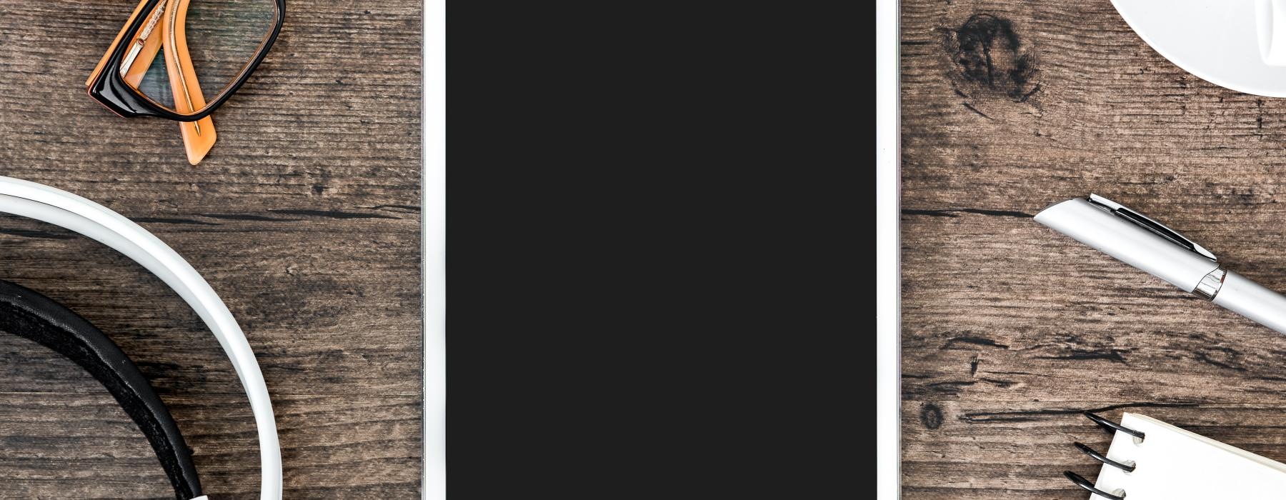 a tablet and a keyboard on a table