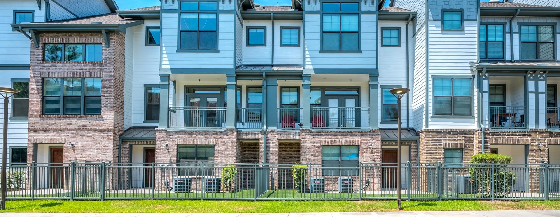 a large building with a fence in front of it